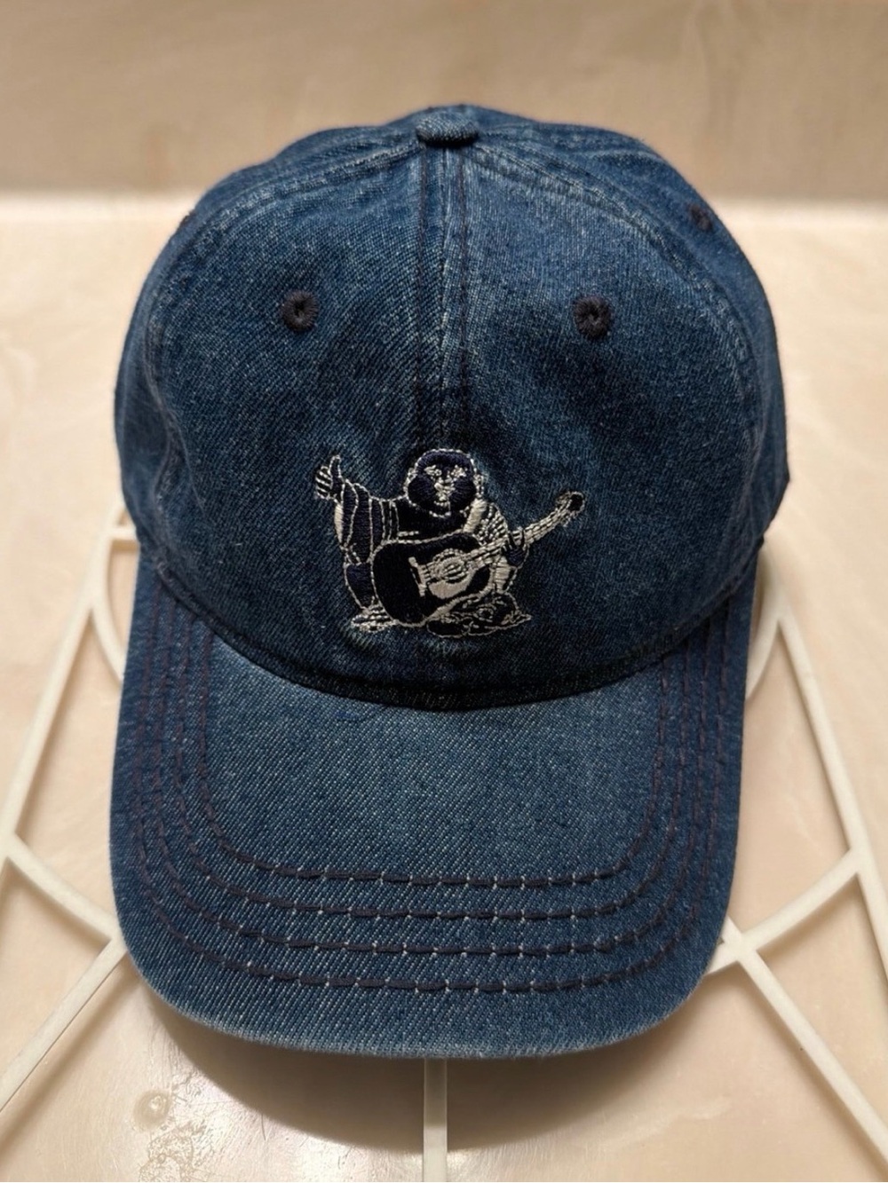 True Religion Blue Denim Baseball Cap with Embroidered Buddha Guitar